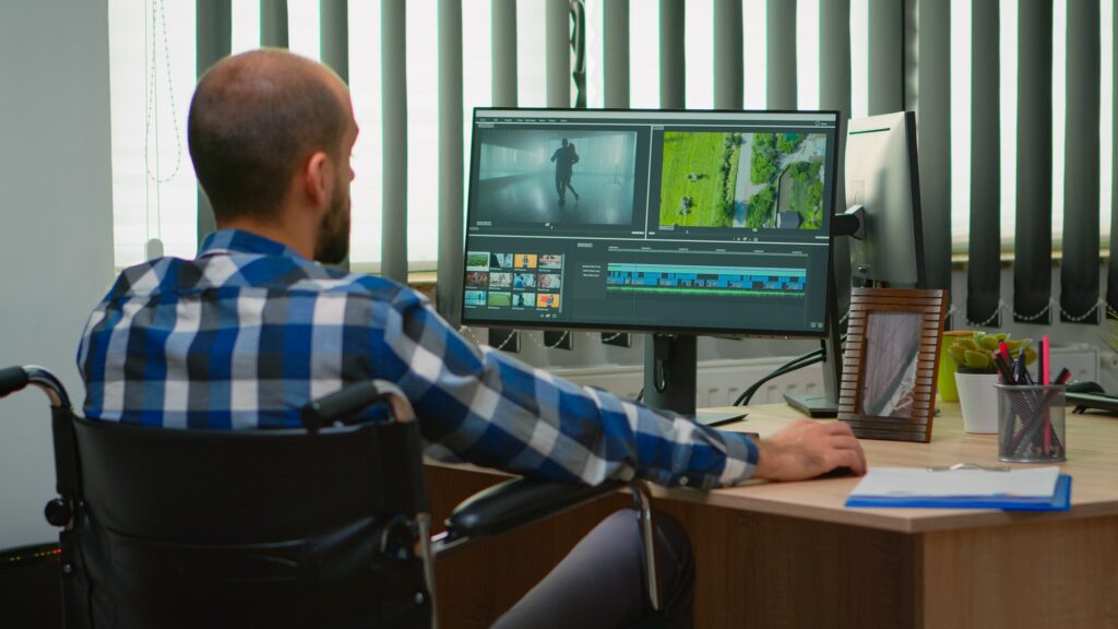 Disabled videographer editing a video project