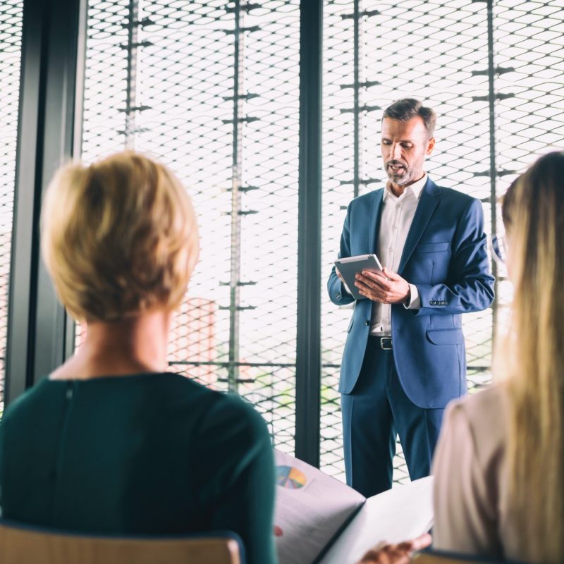 Businessman coach in the auditorium